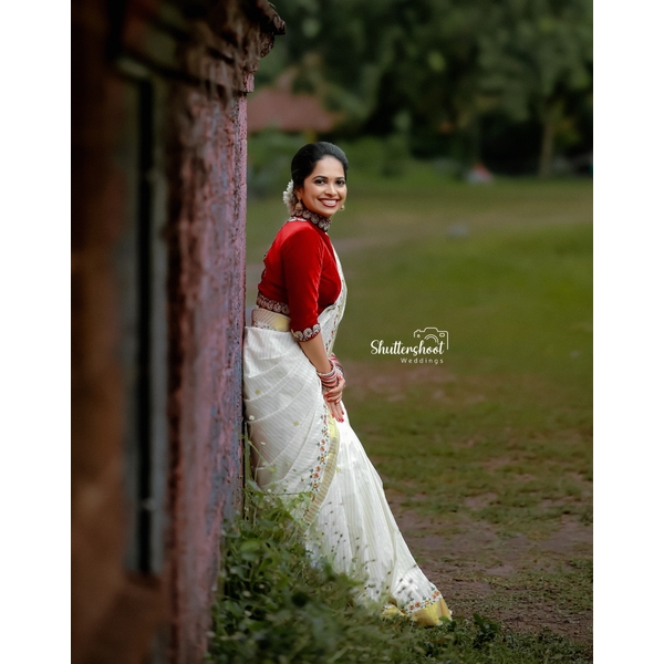 Exquisite Kasavu Saree With Floral Embroidery And Maroon Velvet Blouse Sangeet/ Reception Edit thumbnail 4